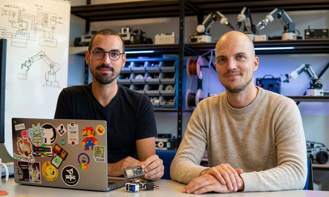 Team members with robot